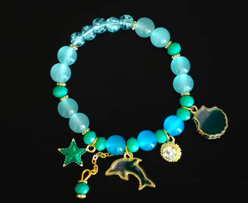 Ocean-Inspired Beaded Bracelet With Dolphin Starfish & Gem Charms Adjustable Gold-Plated Accent Design